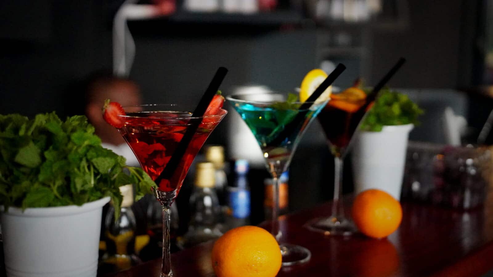 Signature cocktails lined up on the bar at The Yard